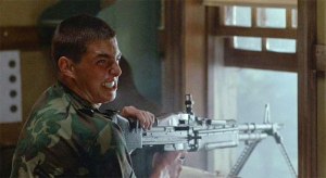 A young Tom Cruise loving his machine gun in "Taps"